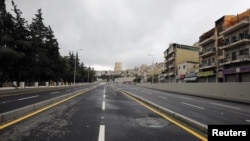 The streets of the Jordanian capital are seen empty after the start of a nationwide curfew, amid concerns over the coronavirus spread, in Amman, Jordan, March 21, 2020.