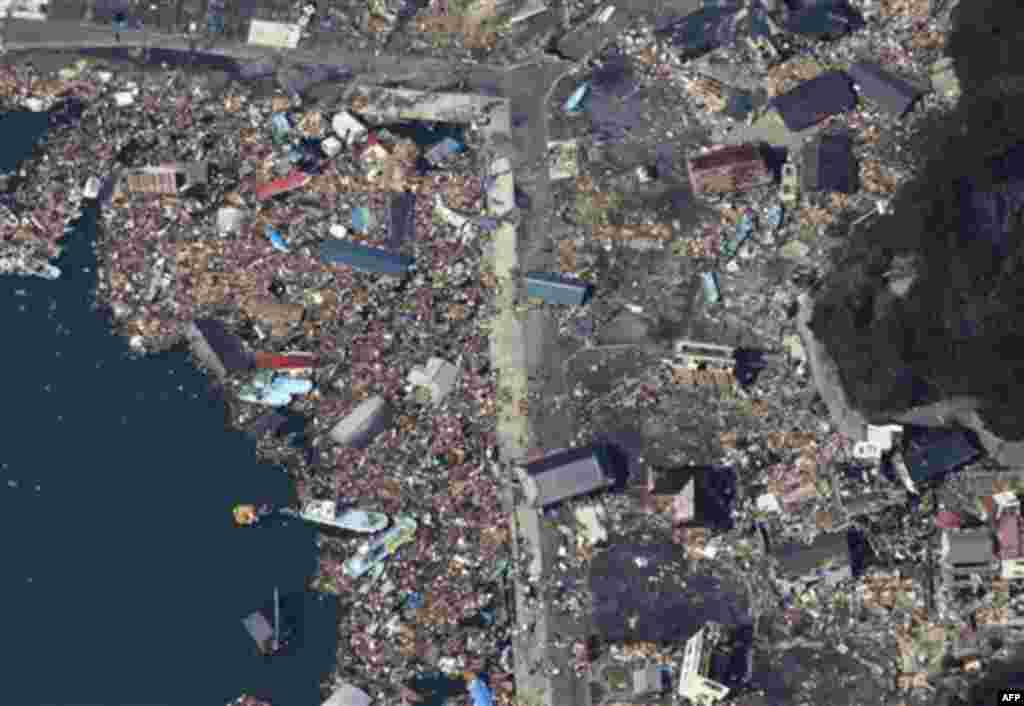 Debris covers part of a fishing port on Izushima island in Onagawacho, northern Japan, Monday, March 14, 2011, three days after a powerful earthquake-triggered tsunami hit the country's east coast. (AP Photo/The Yomiuri Shimbun, Atsushi Taketazu) JAPAN OU