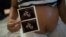 FILE - Isabela Cristina, 18, who is six months pregnant, shows a photo of her ultrasound at the IMIP hospital in Recife, Pernambuco state, Brazil.