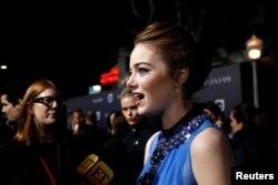 Cast member Emma Stone is interviewed at the premiere of "La La Land" in Los Angeles, Dec. 6, 2016. The musical was named one of 2016's top 10 movies by the American Film Institute, Thursday, Dec. 8, 2016.