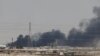 FILE - Smoke is seen following a fire at Aramco facility in the eastern city of Abqaiq, Saudi Arabia, Sept. 14, 2019.