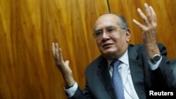 FILE - Judge Gilmar Mendes gestures during an interview with Reuters in Brasilia, Brazil, Aug. 22, 2019. 