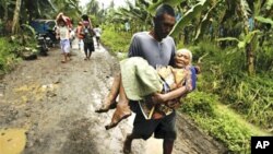 菲律宾水灾时有发生。图为今年1月该国南部导致至少53人死亡的洪灾