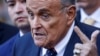 FILE - Former Donald Trump lawyer and former New York Mayor Rudy Giuliani speaks to the media outside U.S. Federal Court after failing to surrender valuables to Georgia election workers he was found to have defamed, in New York on Nov. 7, 2024.