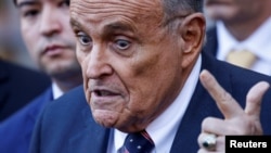 FILE - Former Donald Trump lawyer and former New York Mayor Rudy Giuliani speaks to the media outside U.S. Federal Court after failing to surrender valuables to Georgia election workers he was found to have defamed, in New York on Nov. 7, 2024.