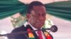 Zimbabwe President Emmerson Mnangagwa takes his oath of office in Harare on August 26, 2018. / AFP PHOTO / Jekesai NJIKIZANA