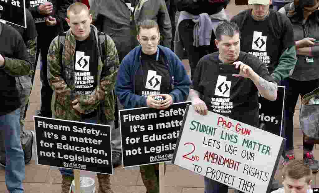 Pro-gun marchers gather during a rally designed by organizer to advocate for fortified schools and more armed teachers Saturday, March 24, 2018, at the Utah State Capitol, in Salt Lake City.