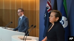 Assistant Treasurer Stephen Jones and Minister for Communications Michelle Rowland attend a news conference in Sydney, Dec. 12, 2024. 