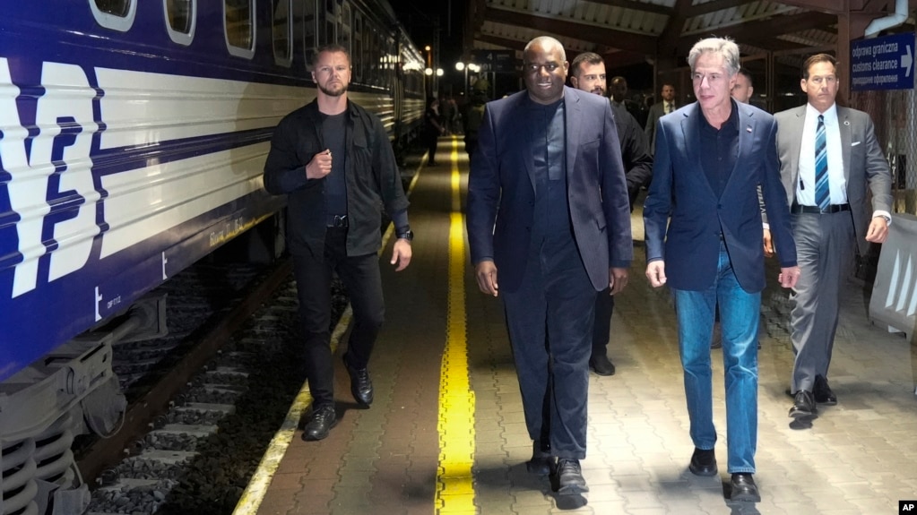 U.S. Secretary of State Antony Blinken, right and British Foreign Secretary David Lammy, walk along a platform to board a train at Przemysl railway station, in Poland, Sept. 11, 2024. 