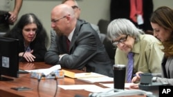 David Turpin, second from right, and wife, Louise, left, are pictured at their sentencing hearing, April 19, 2019, in Riverside, Calif. The California couple pleaded guilty of neglect and abuse of 12 of their 13 children and were given life prison terms.
