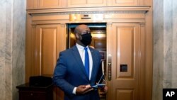 FILE - In this Feb. 13, 2021, photo, Sen. Tim Scott, R-S.C., departs Capitol Hill in Washington. Scott will deliver Republicans’ rebuttal to President Joe Biden’s joint address to Congress. 