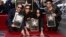 FILE - Maná members Sergio Vallin, from left, Juan Calleros, Alex Gonzalez and Fher Olvera pose together after the Mexican rock band received a star on the Hollywood Walk of Fame, Feb. 10, 2016, in Los Angeles.