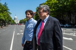 Attorney General William Barr crosses Pennsylvania Avenue NW from the Department of Justice building, May 30, 2020, in Washington.