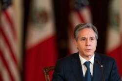 FILE - Secretary of State Antony Blinken speaks during a virtual meeting with Mexican Secretary of Economy Tatiana Clouthier, who is in Mexico City, Feb. 26, 2021, in the Benjamin Franklin room at the State Department in Washington.