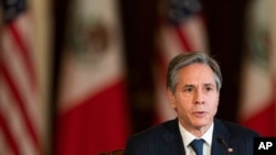 Secretary of State Antony Blinken speaks during a virtual meeting with Mexican Secretary of Economy Tatiana Clouthier, who is in Mexico City, Feb. 26, 2021, in the Benjamin Franklin room at the State Department in Washington. 