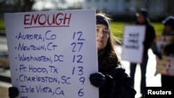 FILE - Gun control activists rally in front of the White House, Washington, Jan. 4, 2016.