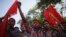 Activists and garment workers shout slogans during a protest demanding a minimum wage of 8,000 Bangladeshi Taka [$100] in Dhaka, Bangladesh, Nov. 8, 2013.