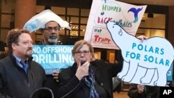 FILE - In this Feb. 15, 2018 photo, Judith Enck, former official of the Environmental Protection Agency addresses a protest, saying President Trump exceeded his authority when he reversed a ban on offshore drilling in vast parts of the Arctic Ocean.