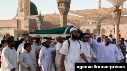 Mourners carry the coffin of the late former Tunisian president Zine El Abidine Ben Ali during his funeral at the Prophet Mohammed's mosque in Saudi Arabia's holy city of Medina, Islam's second holiest city, on Sept. 21, 2019. 