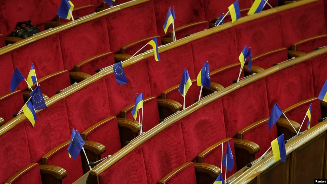 Ukrainian and EU flags are seen before a session of parliament in Kyiv Nov. 21, 2013.