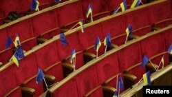 Ukrainian and EU flags are seen before a session of parliament in Kyiv Nov. 21, 2013.