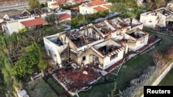 FILE - Damaged houses are seen, following the deadly October 7 attack by gunmen from Palestinian militant group Hamas from the Gaza Strip, in Kibbutz Beeri in southern Israel, November 28, 2023.