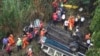 Firefighters work the scene of a fatal bus crash after it fell from a bridge on the outskirts of Guatemala City, Guatemala, Feb. 10, 2025.