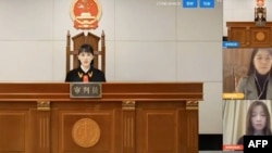 A virtual judge hears litigants in a case before a Chinese "internet court" in Hangzhou, China. (Courtesy: AFP/YouTube video) 