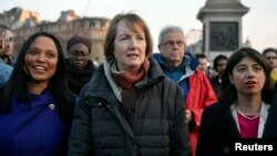 FILE - Labour politician Harriet Harman joins a vigil in Trafalgar Square, in London, March 23, 2017. 