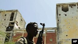 A Somali government soldier patrols the streets of capital Mogadishu, February 22, 2012