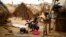 FILE - Families living in a refugee camp prepare food in Kaga-Bandoro, Central African Republic, Feb. 16,  2016. Nearly half of the country's population of 4.6 million is in need of humanitarian assistance.