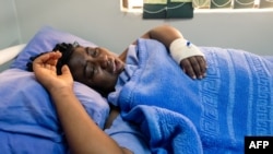 FILE - Activist Joana Mamombe lies hospitalized in Harare on May 15, 2020. after allegedly being abducted and beaten by police and eventually dumped along the roadside some distance from the capital.