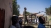 A Sudanese army soldier controls a machine gun outside a hospital in Omdurman on November 2, 2024. The UN Security Council on November 18, 2024, will take up a draft resolution calling for an immediate end to hostilities in Sudan.