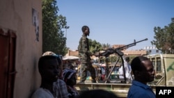 A Sudanese army soldier controls a machine gun outside a hospital in Omdurman on November 2, 2024. The UN Security Council on November 18, 2024, will take up a draft resolution calling for an immediate end to hostilities in Sudan.