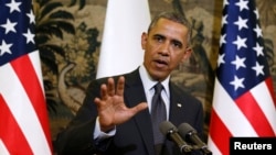 U.S. President Barack Obama speaks as he and President Bronislaw Komorowski of Poland hold a news conference after their meeting at Belweder Palace in Warsaw, June 3, 2014. 