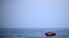 FILE - Migrants travel in an inflatable boat across the English Channel bound for Dover on the south coast of England. U.K. Prime Minister Rishi Sunak on April 22, 2024, promised to begin deporting asylum seekers to Rwanda in the coming months as part of a plan to deter arrivals.