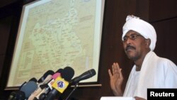 Sudan's Defense Minister Abdel Raheem Muhammad Hussein shows a map highlighting contested borderlands between Sudan and South Sudan during a news conference in Khartoum, Sudan, June 8, 2012.