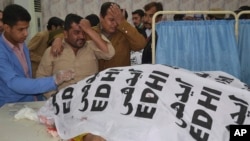 People mourn the death of a police officer and his family members, at a hospital in Quetta, Pakistan, Nov. 15, 2017. 