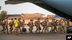 FILE: FILE - French Barkhane force soldiers who wrapped up a four-month tour of duty in the Sahel leave their base in Gao, Mali, June 9, 2021. French officials announced Monday Aug. 15, 2022 that the last soldier from the operation has now left Mali, 
