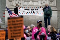 Demonstrators rally outside the New York Public Library calling for the counting of all votes cast in the U.S. presidential election, in New York City, Nov. 4, 2020.