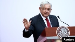 FILE - Mexico's President Andres Manuel Lopez Obrador gives a speech marking the first 100 days of his presidency at the National Palace in Mexico City, Mexico, March 11, 2019. 