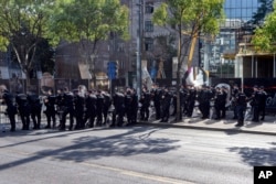 Serbian police officers cordon off a street during a pride march in Belgrade, Serbia, Sept. 7, 2024. The march was held under heavy police protection because of possible attacks from right-wing extremists.