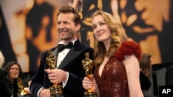 Trent, left, and Victoria Warmerdam, winners of the award for best live action short film for "I'm Not a Robot," attend the Governors Ball after the Oscars on March 2, 2025, in Los Angeles.