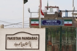 FILE - General view of a closed gate at Pakistan and Iran's border posts, after Pakistan sealed its border with Iran following the coronavirus outbreak, at the border post in Taftan, Feb. 25, 2020.