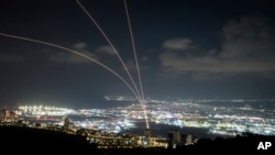 Israeli Iron Dome aerial  defence  strategy   fires to intercept rockets that were launched from Lebanon, arsenic  seen from Haifa, bluish   Israel, Monday, Sept. 23, 2024.