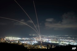 Israeli Iron Dome air defense system fires to intercept rockets that were launched from Lebanon, as seen from Haifa, northern Israel, Sept. 23, 2024.