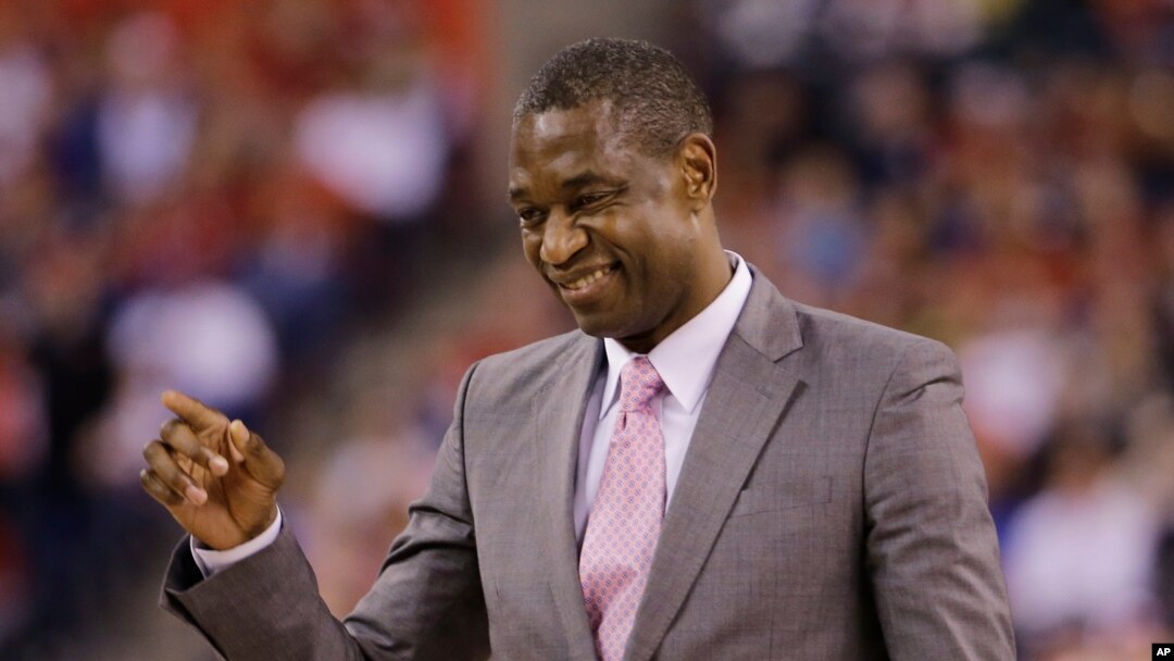 FILE - Former NBA player Dikembe Mutumbo reacts on the court during the second half of the NCAA Final Four college basketball tournament championship game between Wisconsin and Duke, April 6, 2015, in Indianapolis. 