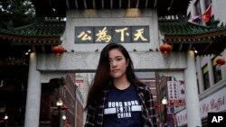 Emerson College student Frances Hui poses in the Chinatown neighborhood of Boston, Oct. 2, 2019. Hui, of Hong Kong, faced threatening language from classmates from mainland China after she published a column, "I am from Hong Kong, not China." 