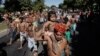 Munduruku Indians march to the Ministry of Mines and Energy, in Brasilia, Brazil, Tuesday, June 11, 2013. The group along with other had been occupying the controversial Belo Monte dam being built in the Amazon on the Xingu River. They were recently flown