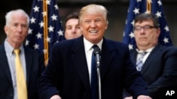 FILE - Republican presidential candidate Donald Trump speaks during a campaign event in the atrium of the Old Post Office Pavilion, soon to be a Trump International Hotel, March 21, 2016, in Washington.